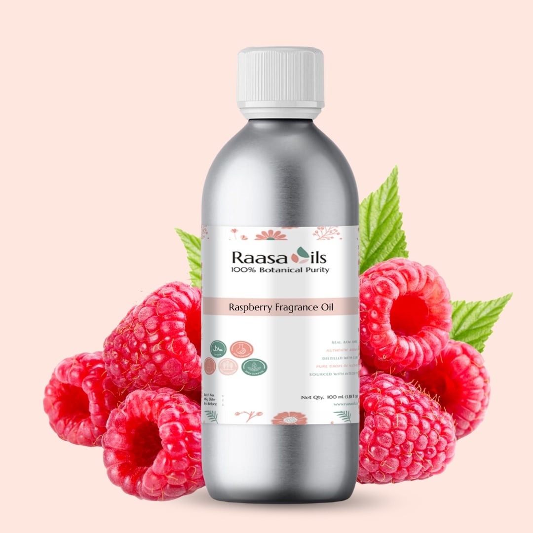 Bottle of Raasa Oils Raspberry Fragrance Oil with raspberries and leaves on a light pink background