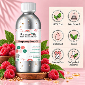 A bottle of Raasa oils Raspberry Seed Oil centered on a pink background, surrounded by fresh raspberries, green leaves, and scattered oil droplets. A product information panel on the right lists claims such as 100% Pure, Cold Pressed, Undiluted, Vegan, Cruelty-Free, and No Synthetic Additives.