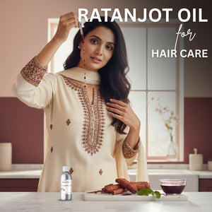 Woman with styled hair holding a dropper of Ratanjot Oil, with product and ingredients on a table.