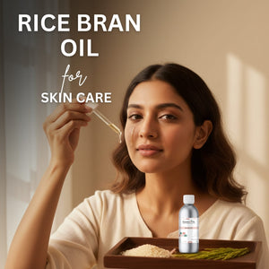 Woman applying rice bran oil to her face with a dropper, surrounded by rice bran and a bottle of oil.