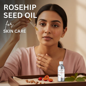 Woman applying rosehip seed oil to her face with a dropper, surrounded by rosehips and a bottle of oil.
