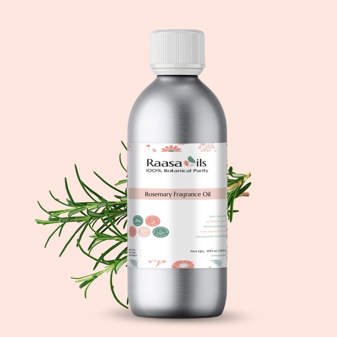 Bottle of Raasa Oils Rosemary Fragrance Oil with rosemary leaves on a light pink background