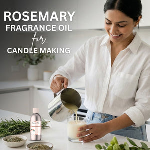 Woman pouring liquid into a glass container with rosemary fragrance oil and rosemary plants on a kitchen counter.