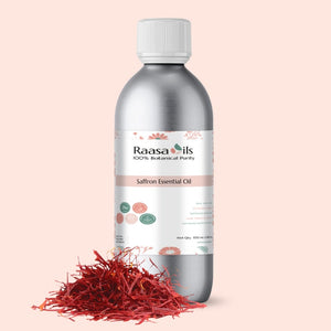 Bottle of Raasa Oils Saffron Essential Oil with saffron strands on a pink background