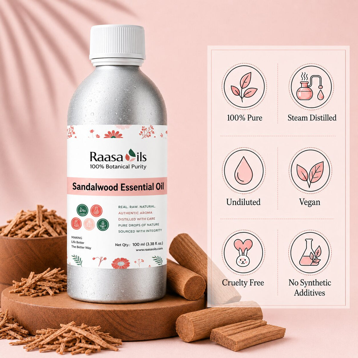 A bottle of Raasa Oils Sandalwood Essential Oil stands on a wooden pedestal against a soft pink background, with scattered sandalwood pieces around the base and a feature infographic on the right highlighting '100% Pure', 'Steam Distilled', 'Undiluted', 'Vegan', 'Cruelty Free', and 'No Synthetic Additives'.