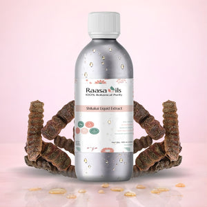 Bottle of Raasa Oils Shikakai Liquid Extract with dried shikakai roots on a pink background