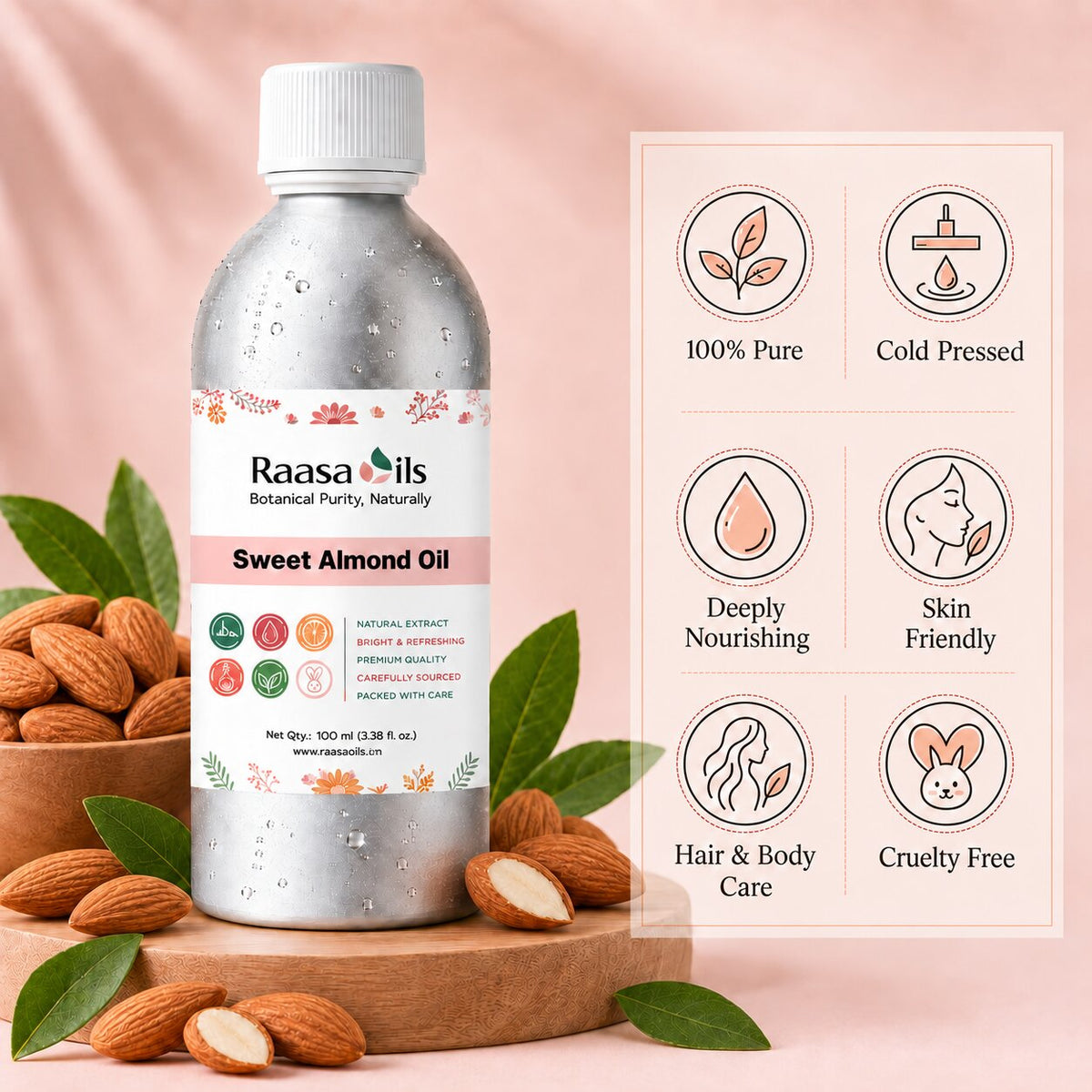 A bottle of Raasails Sweet Almond Oil stands on a wooden board with whole and sliced almonds and green leaves around it. To the right is a pink informational panel with icons and text reading 100% Pure, Cold Pressed, Deeply Nourishing, Skin Friendly, Hair & Body Care, and Cruelty Free.