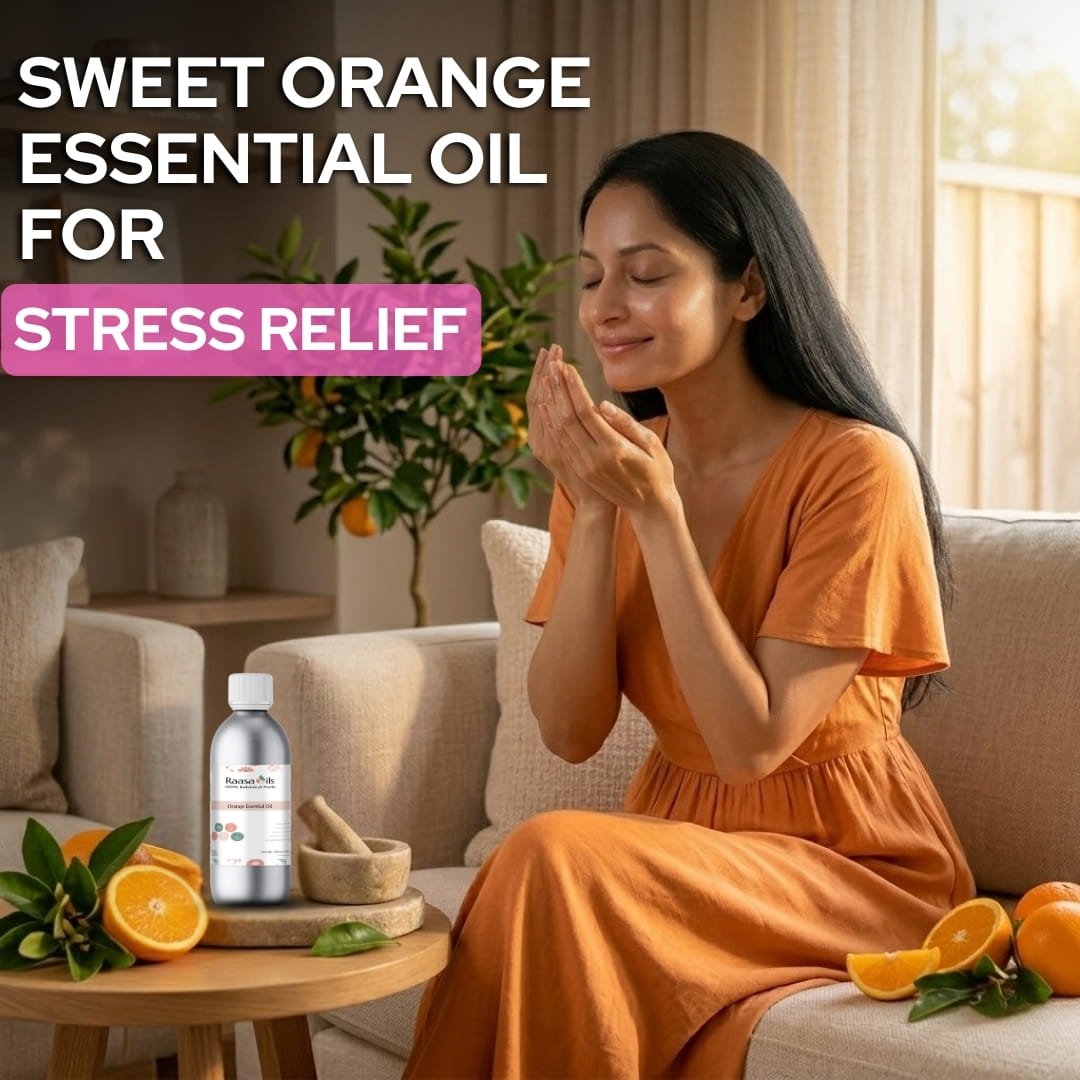 Woman in an orange dress sitting on a couch with sweet orange essential oil for stress relief.