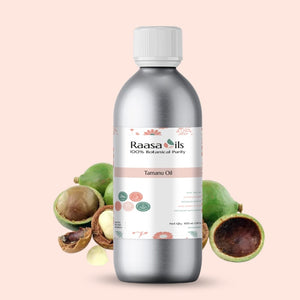 Bottle of Raasa Oils Tamanu Oil with tamanu fruits on a beige background