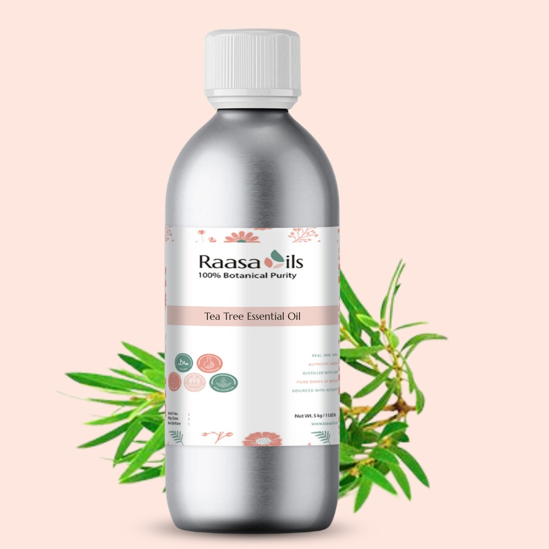 Bottle of Raasa Oils Tea Tree Essential Oil with a pink background and green leaves.