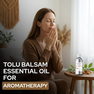 Woman with eyes closed in a peaceful setting with Tolu Balsam essential oil bottle.