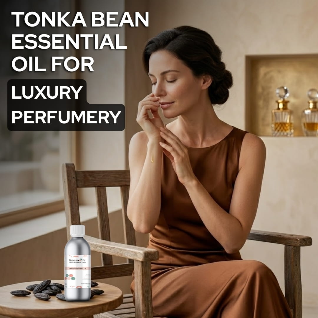 Woman in a brown dress sitting in a chair with Tonka bean essential oil and black stones on a table.