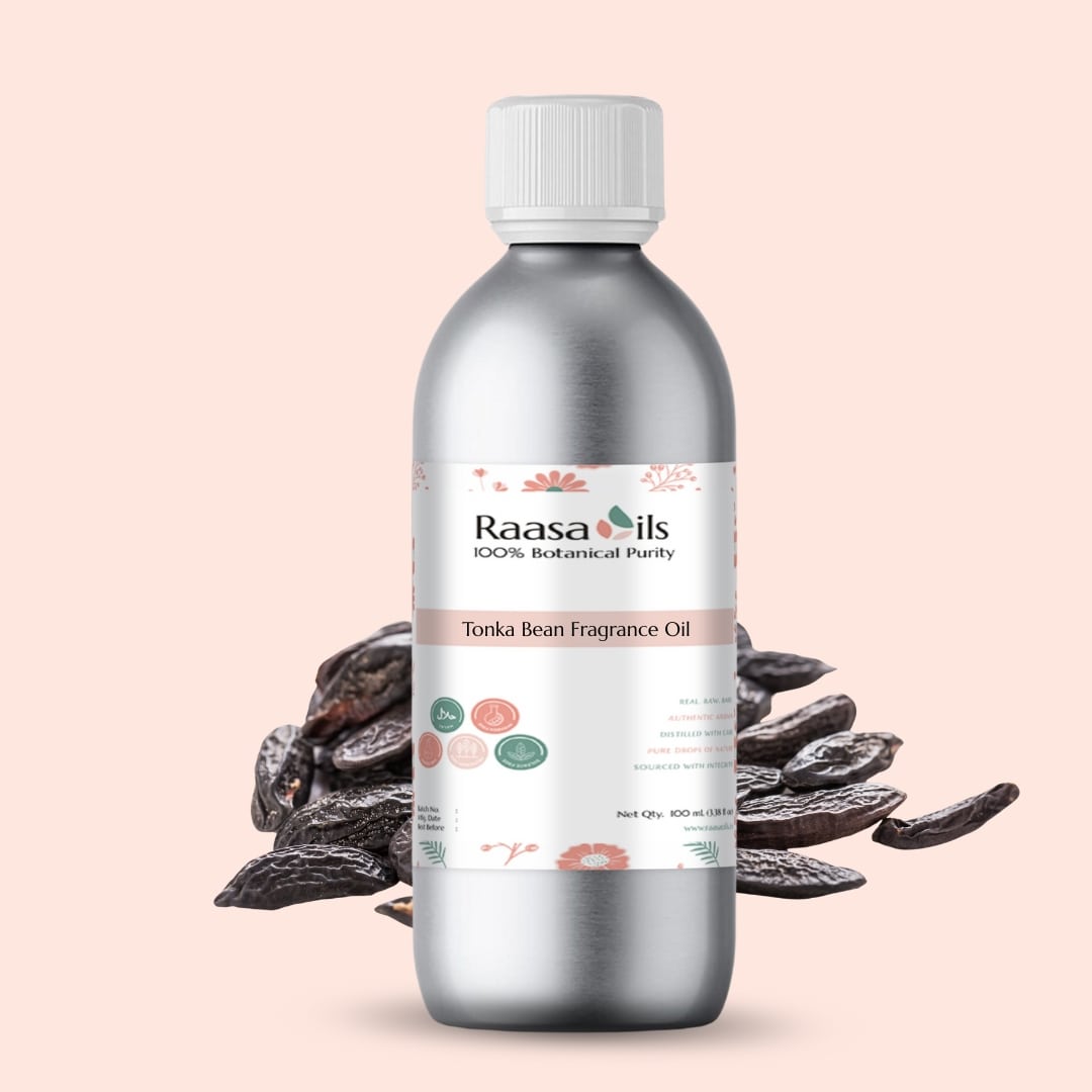 Bottle of Raasa Oils Tonka Bean Fragrance Oil with tonka beans on a light pink background