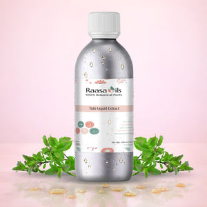 Raasa Oils bottle with green leaves on a pink background