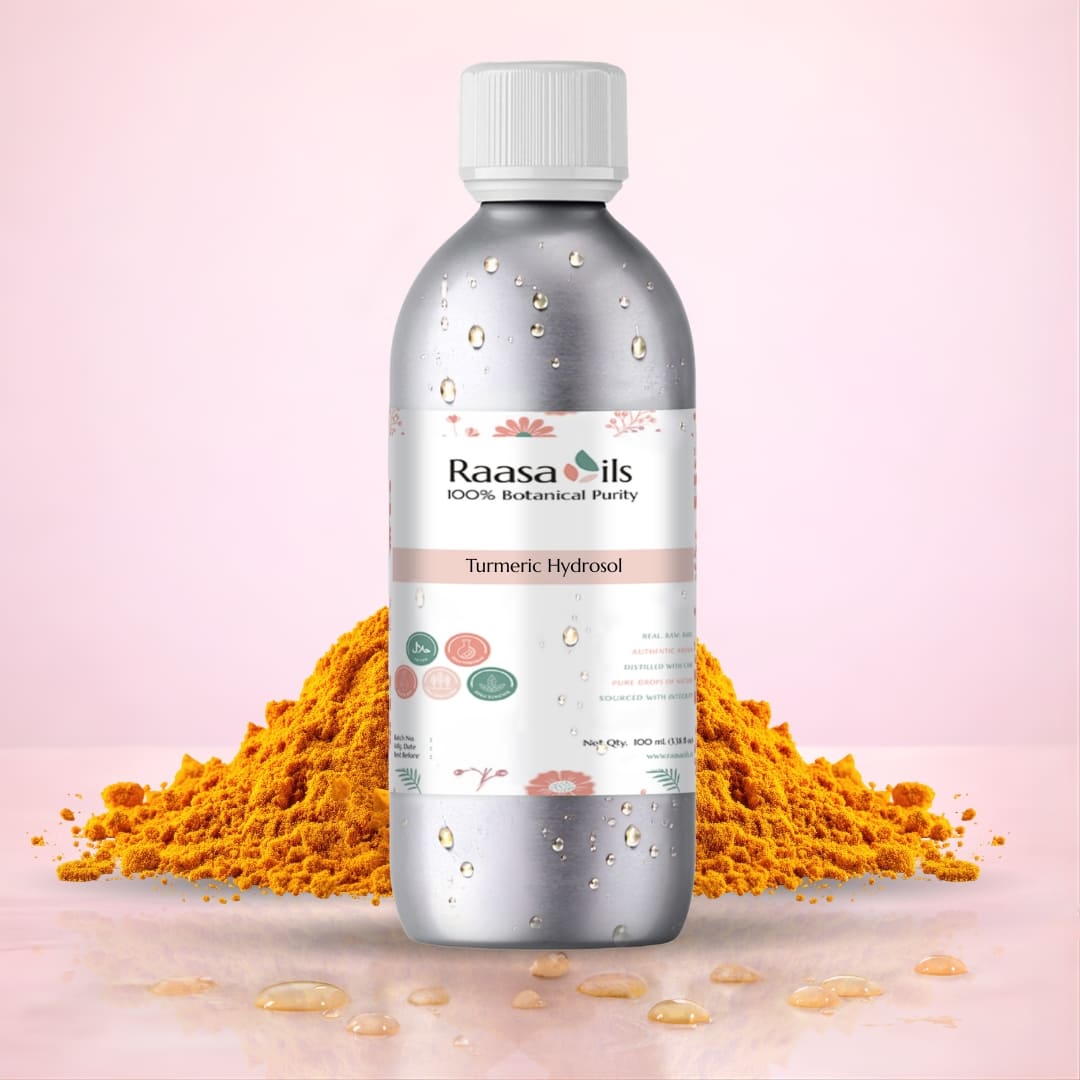 Bottle of Raasa Oils Turmeric Hydrosol with turmeric powder on a pink background