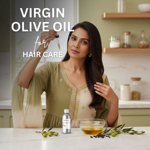 Woman using virgin olive oil for hair care in a kitchen setting