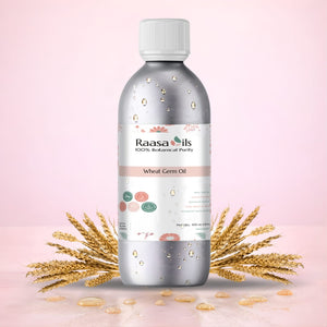 Bottle of Raasa Oils wheat germ oil with wheat stalks on a pink background