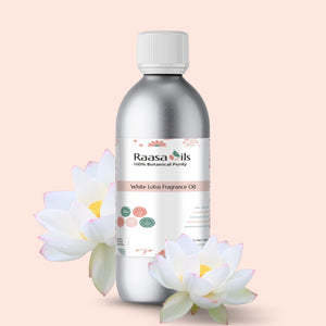 Raasa Oils White Lotus Fragrance Oil bottle with white lotus flowers on a light pink background
