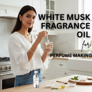 Woman holding a bottle of White Musk fragrance oil in a kitchen setting