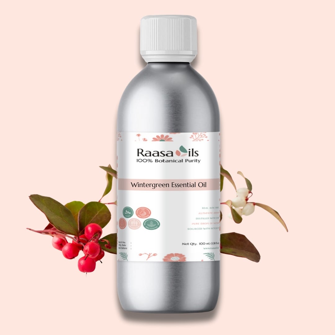 Raasa Oils Wintergreen Essential Oil bottle with a pink background